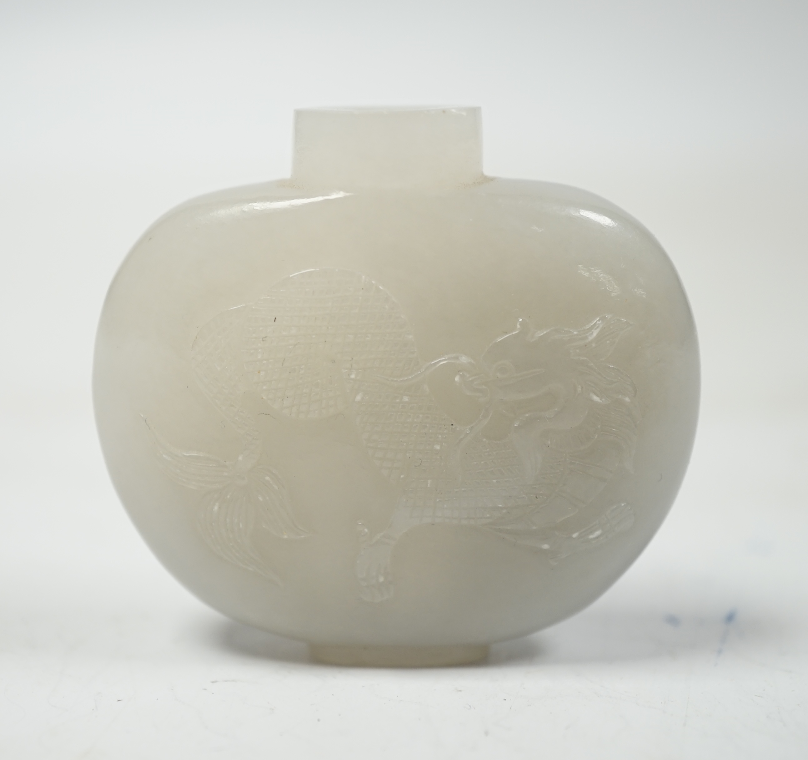 A Chinese white jade ‘chilong’ snuff bottle, 5.5cm wide